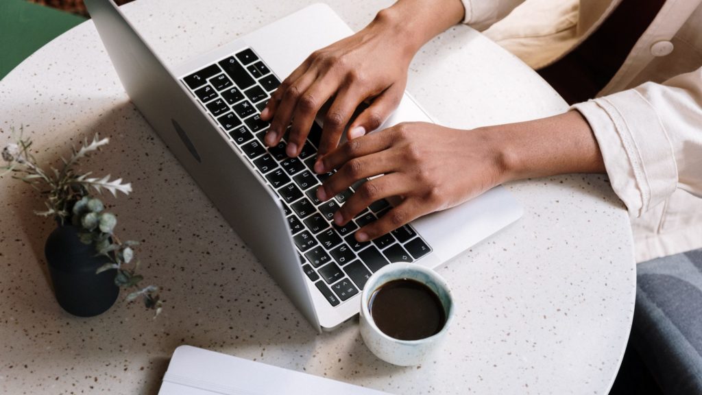 a person typing on a laptop