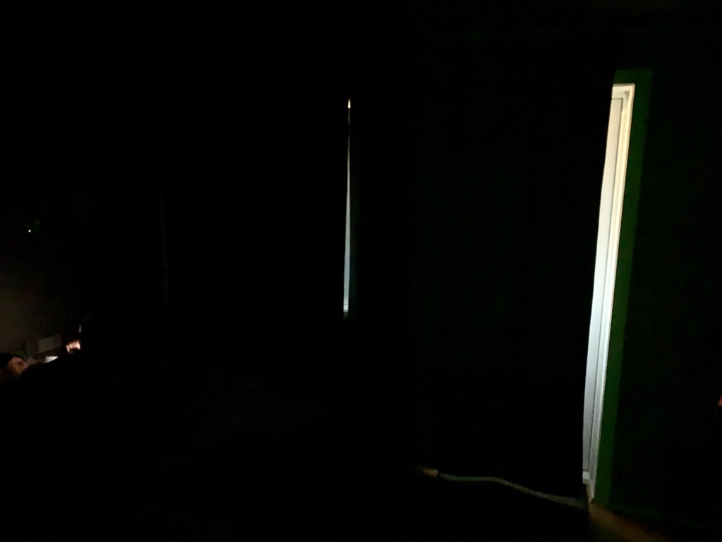 a dark room with a door