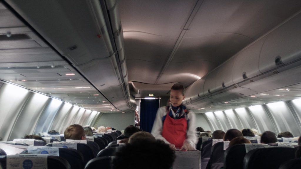 a person standing in an airplane