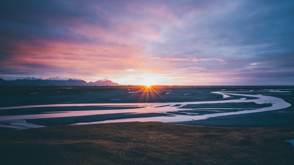 a sunset over a beach