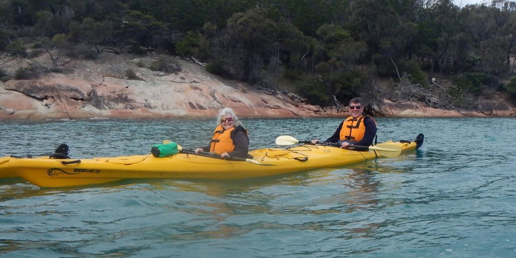 a man and woman in a kayak