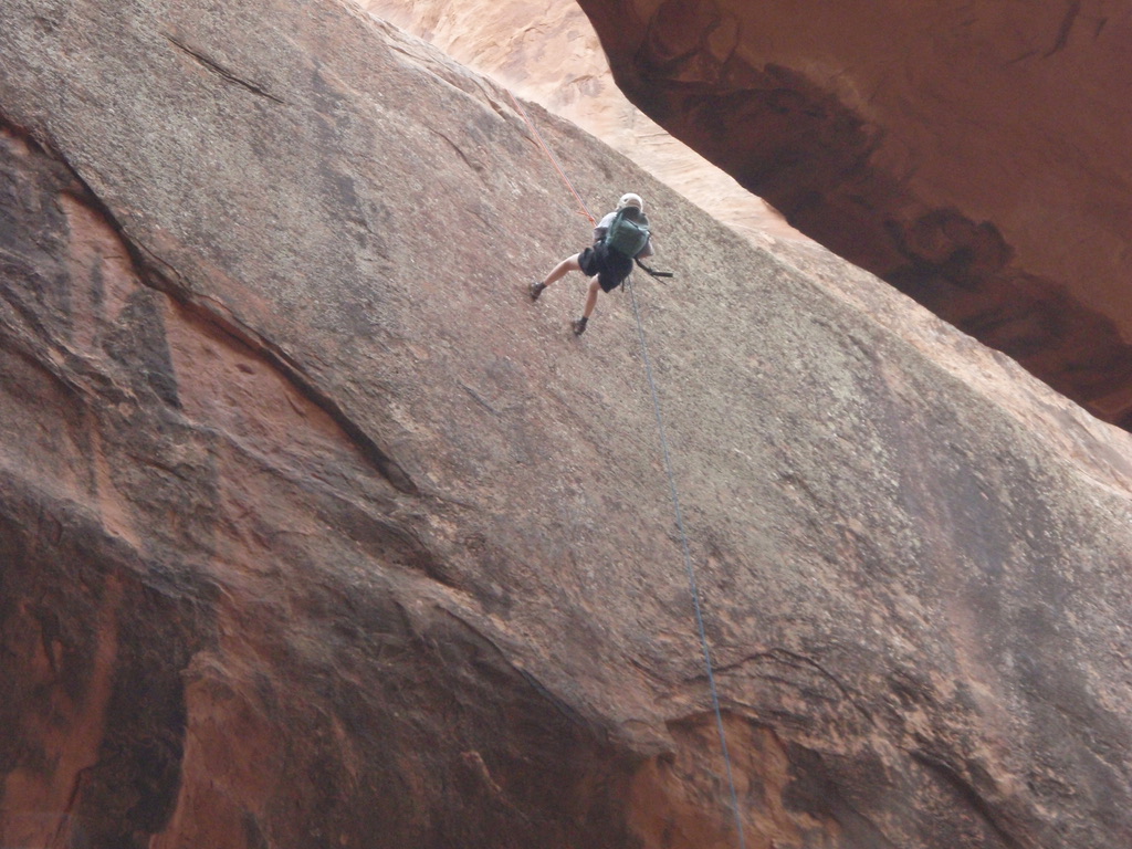 a person climbing a rock wall