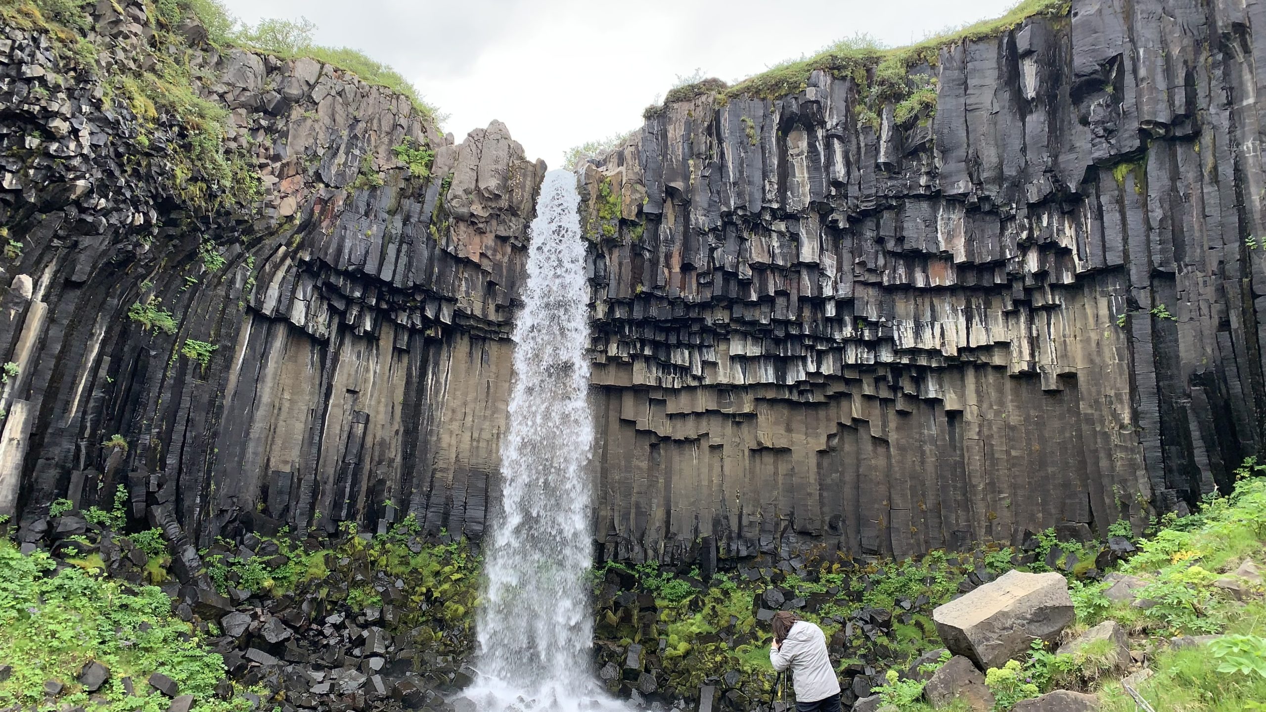 a person standing in front of Skaftafell