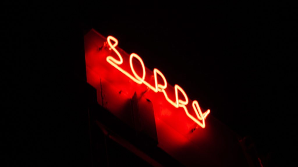 a red neon sign at night