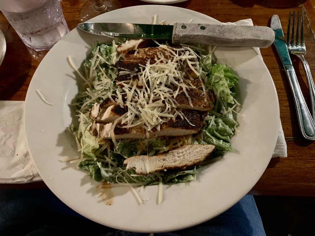 a plate of food with a knife on top