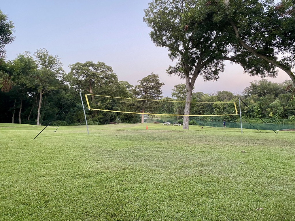 a volleyball net in a park