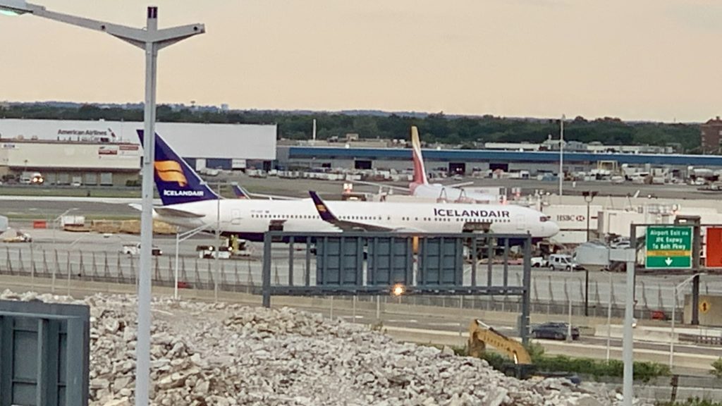 a group of airplanes at an airport