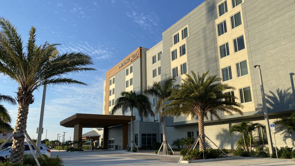 a building with palm trees