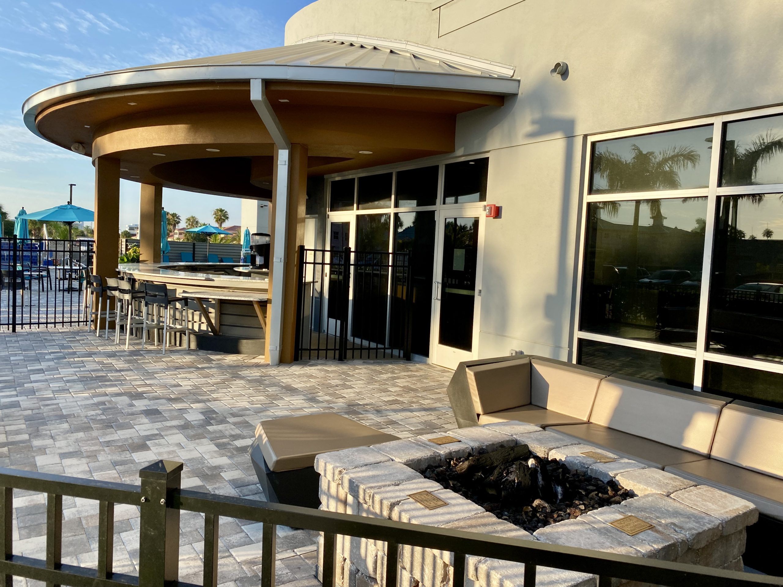 a building with a bar and a fire pit