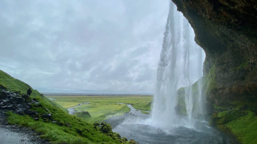 a waterfall in a valley