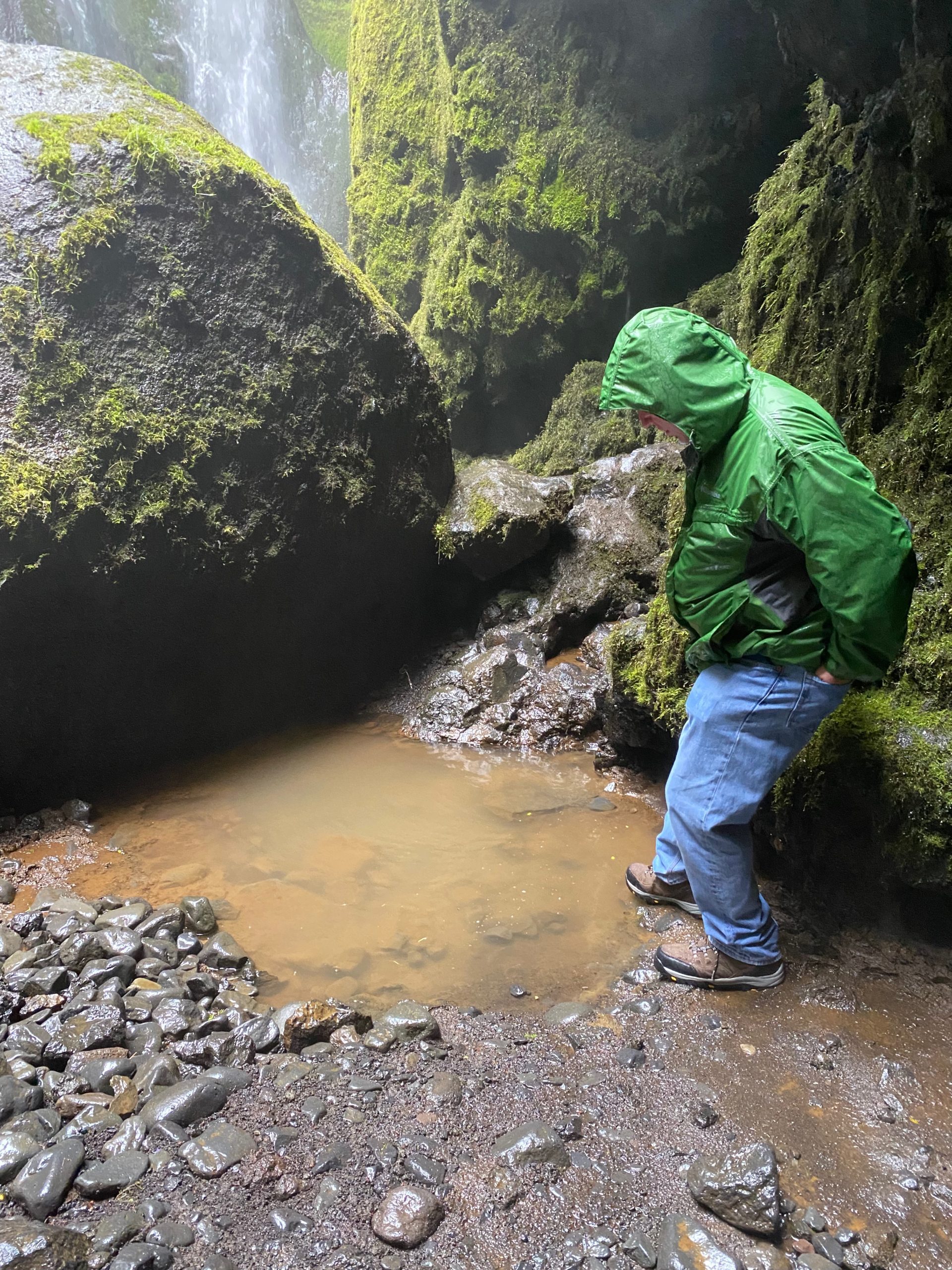a man standing in a puddle of water