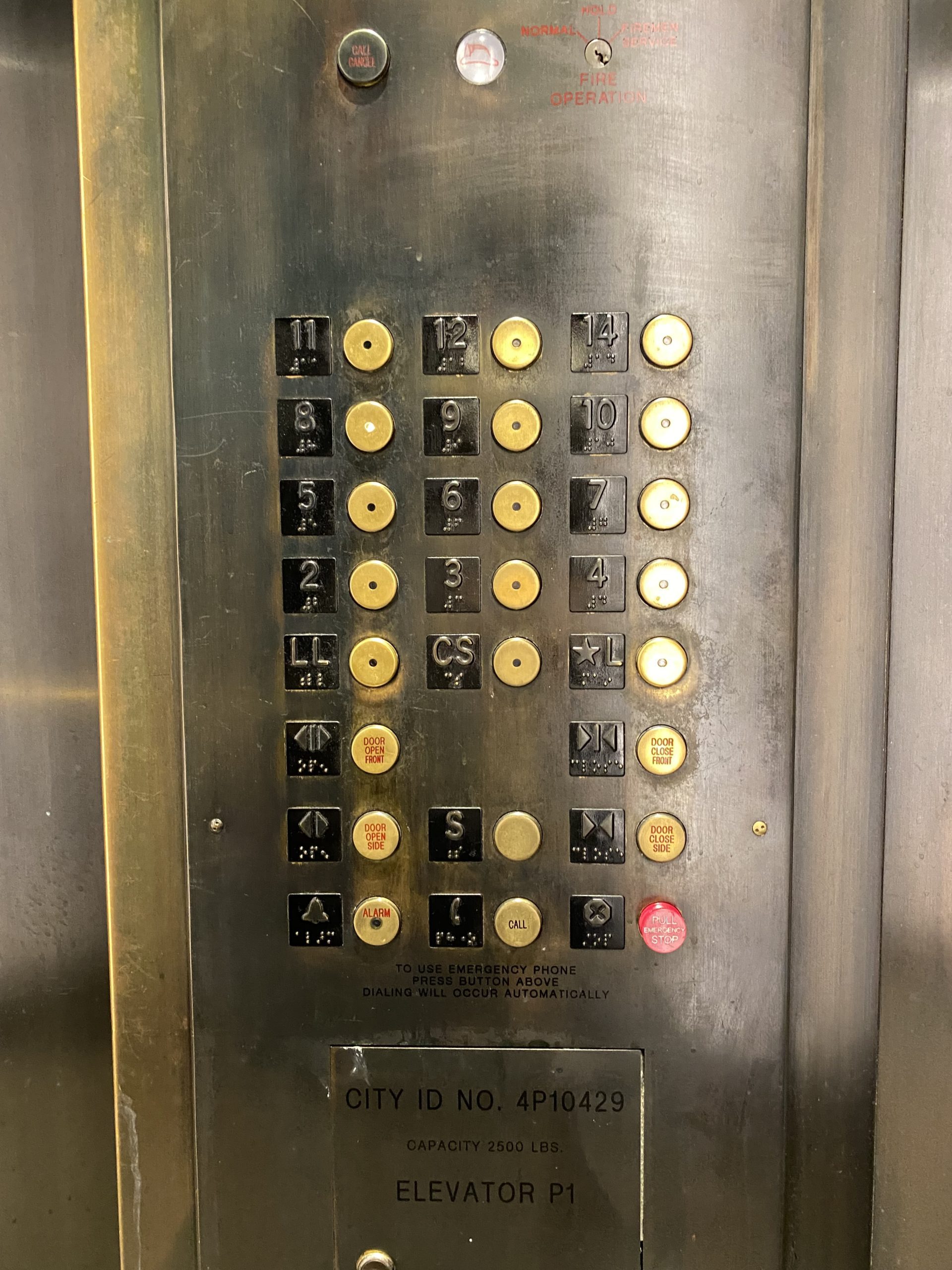 a elevator panel with buttons