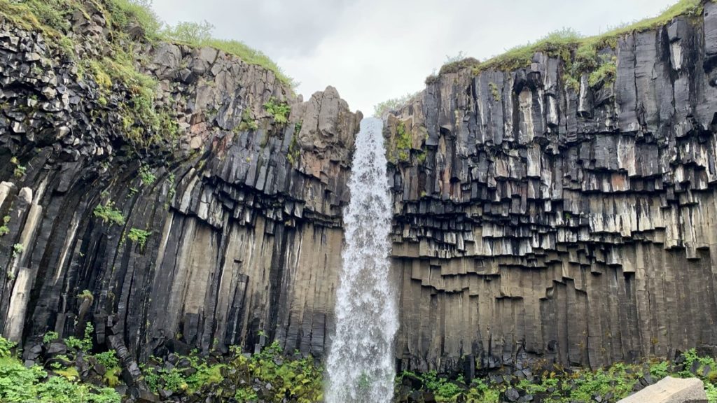 a waterfall over a cliff