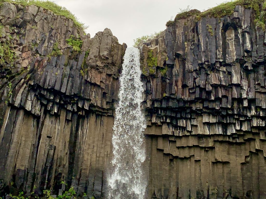 a waterfall over a cliff