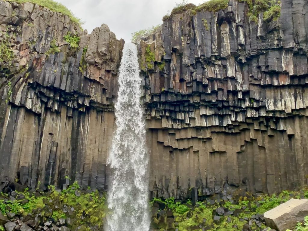 a waterfall over a cliff