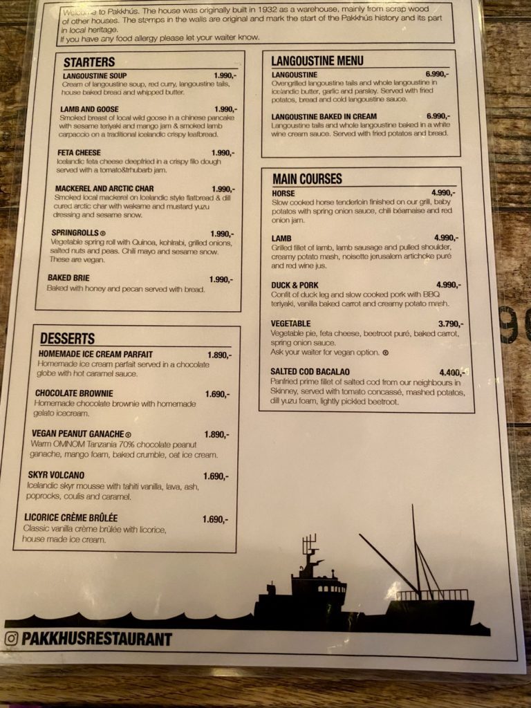 a menu on a wood surface