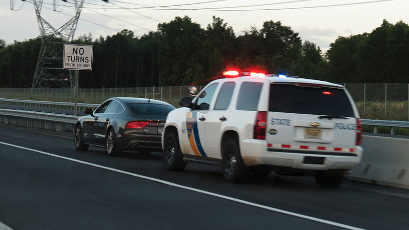 a police car and a police car on the road