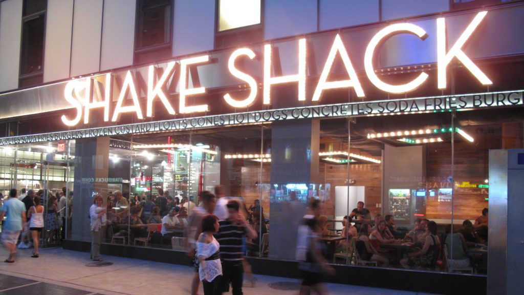 a group of people outside a restaurant