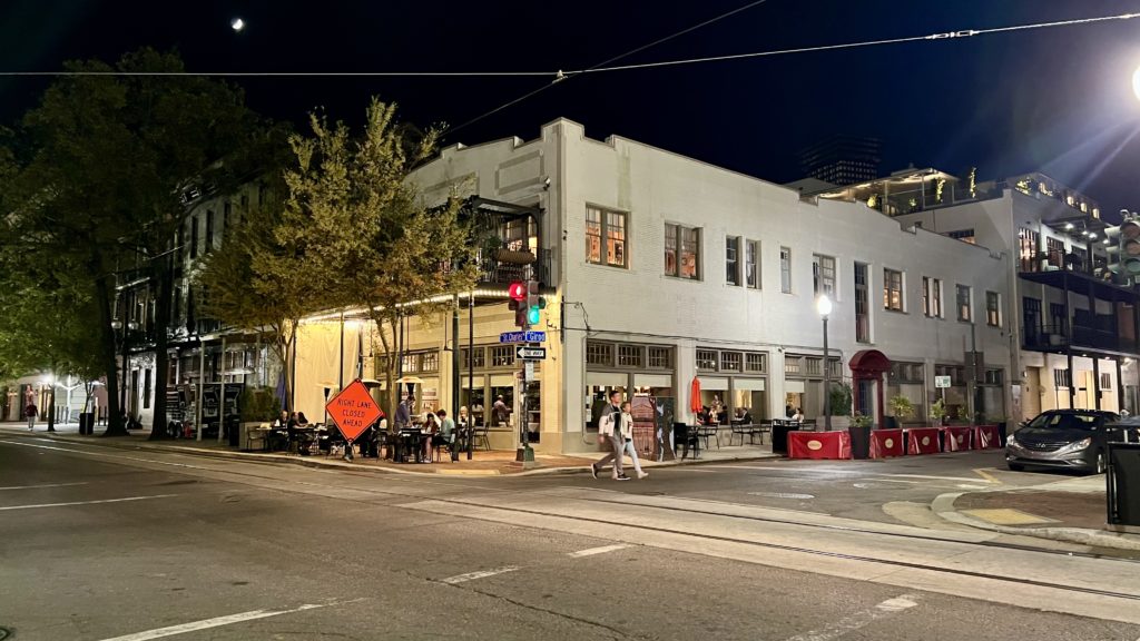 a street corner with people walking on it