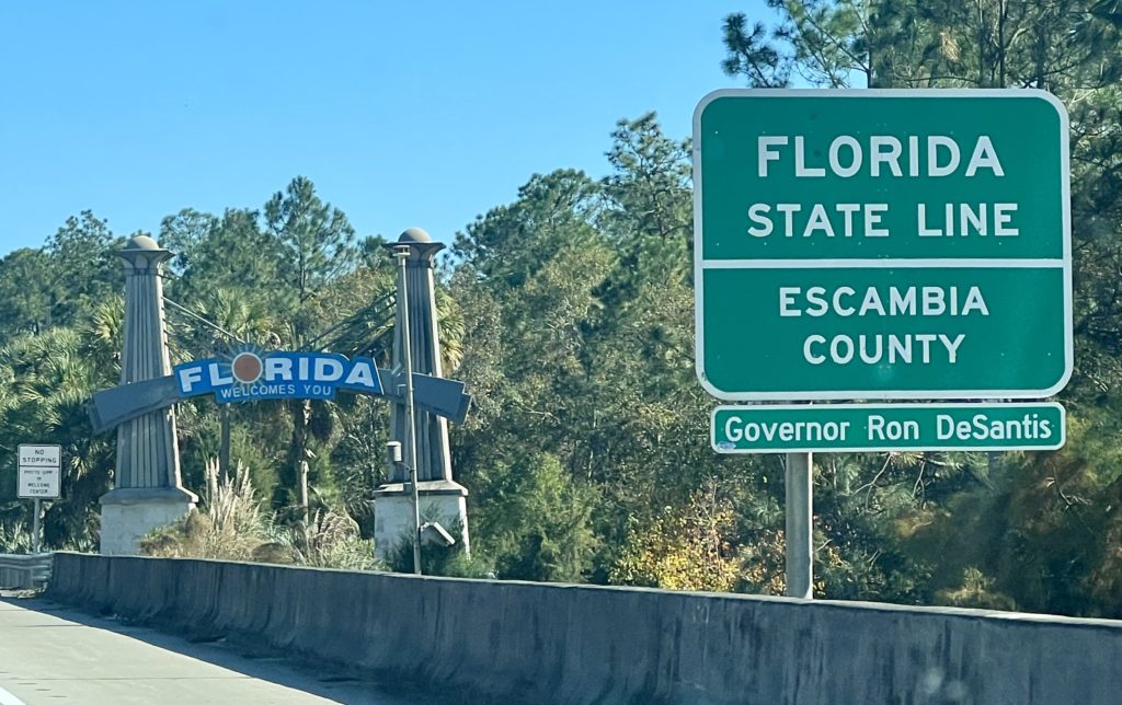 a road sign next to a road