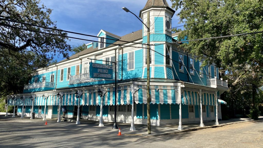 a blue and white building with a tower