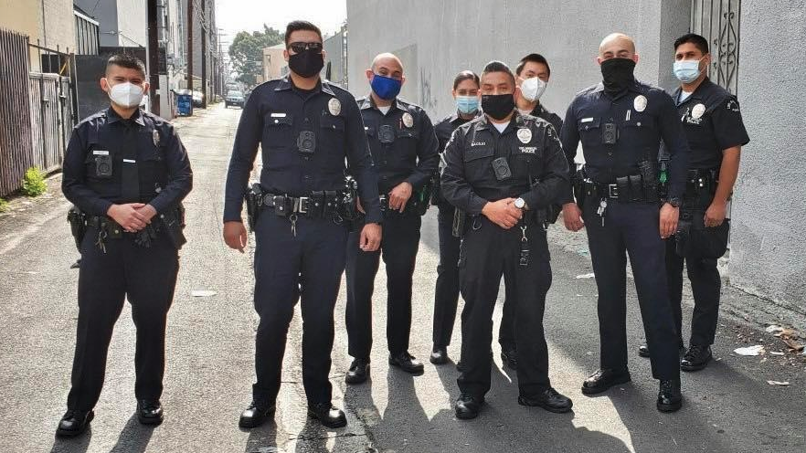 a group of police officers wearing face masks