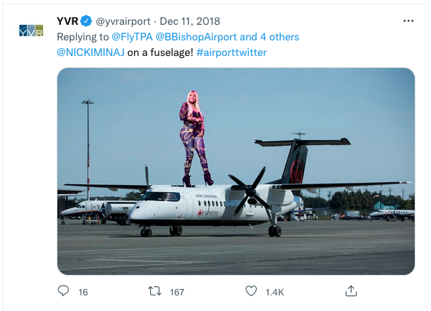 a woman standing on top of a plane