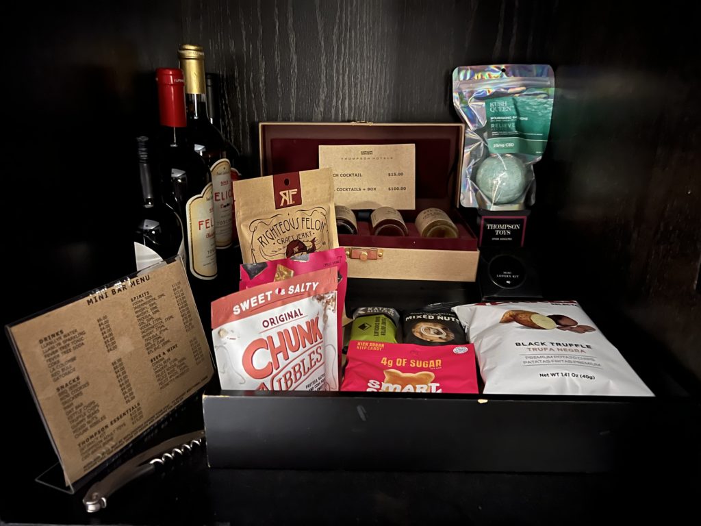 a box of food and wine bottles