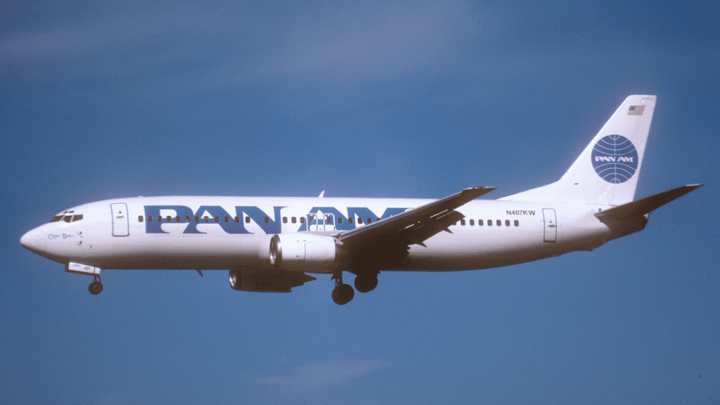 a white airplane with blue writing on it