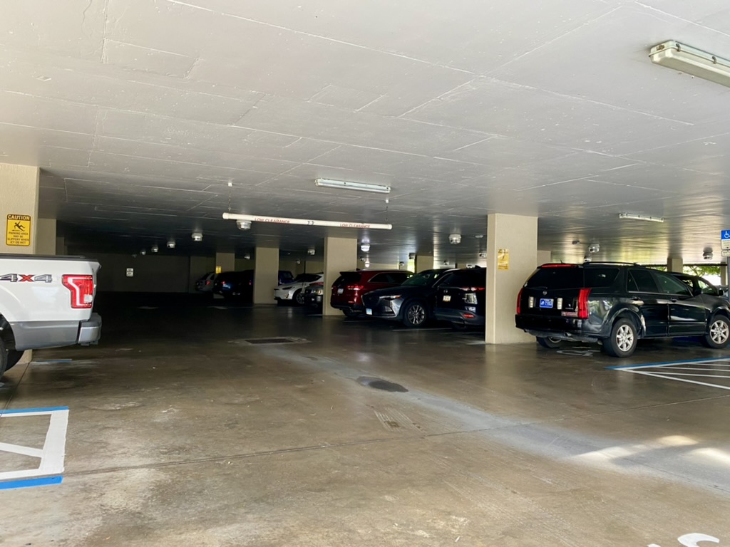 a parking garage with cars parked