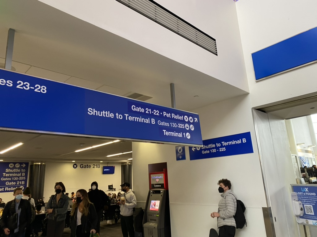 people in a building with signs and people in the background