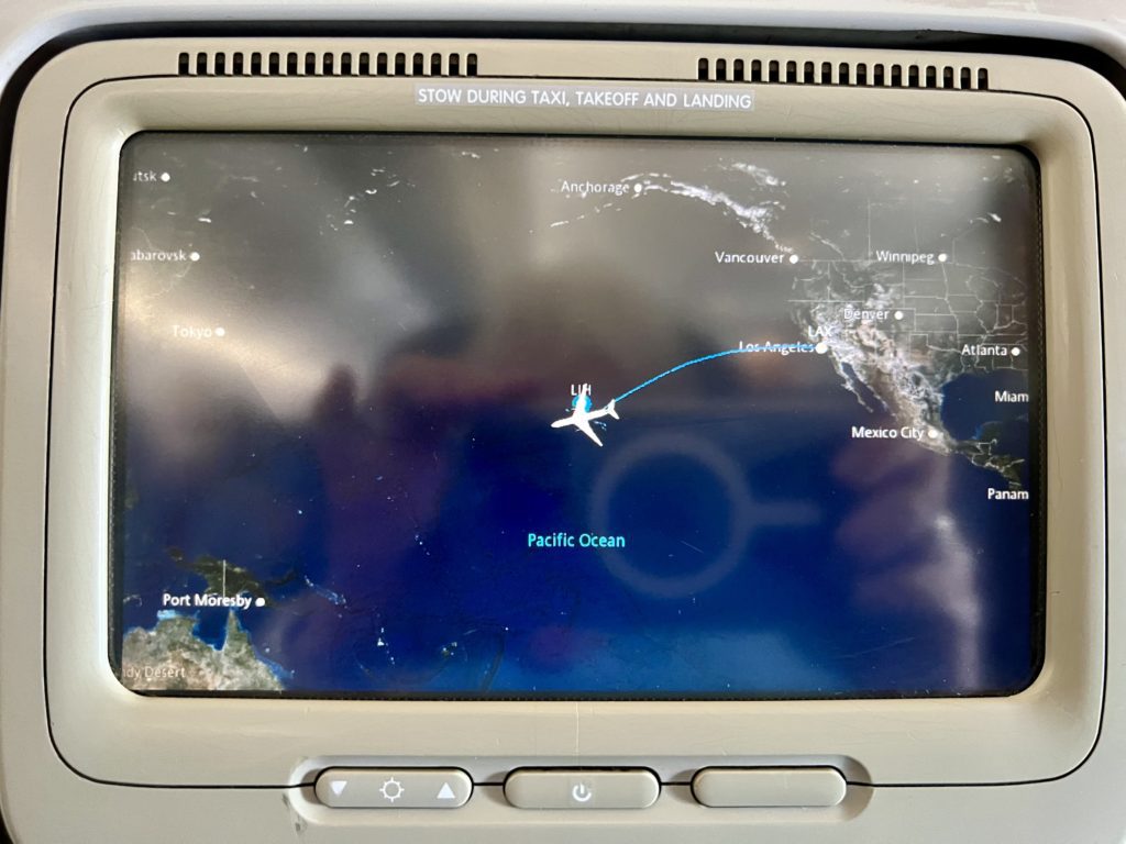 a screen with a map and a plane flying in the sky