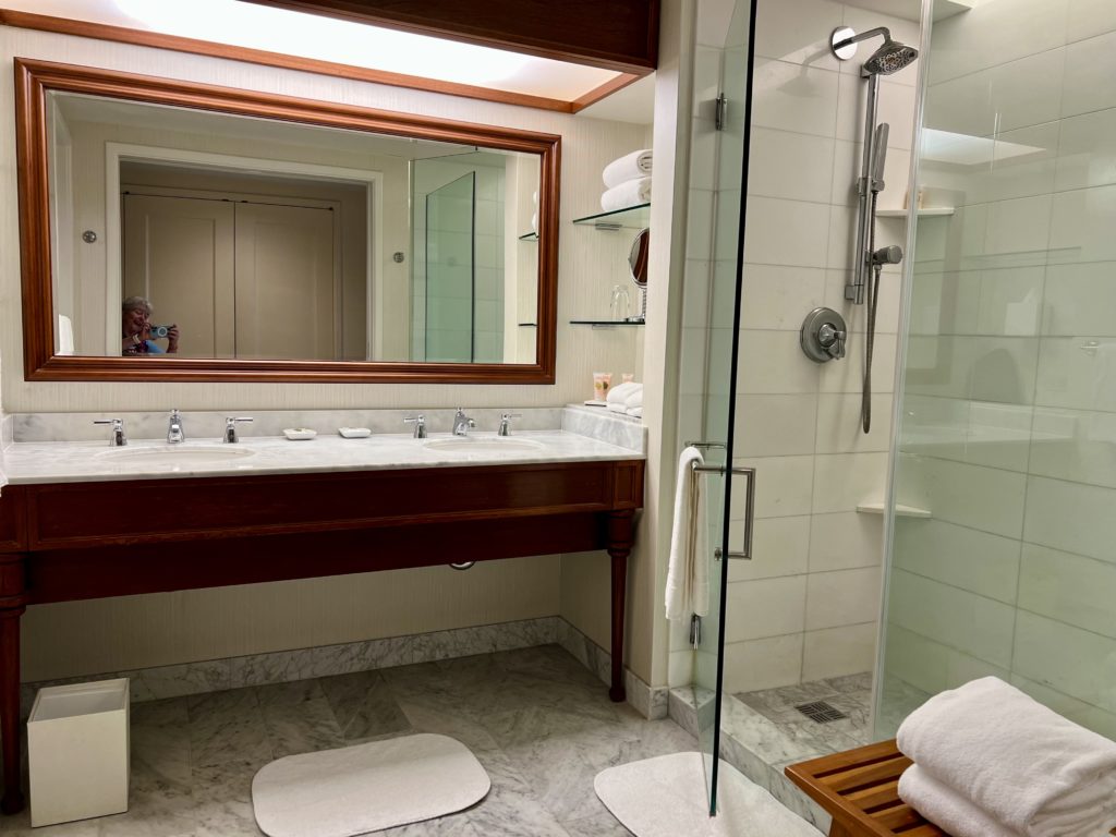 a bathroom with a mirror and a shower