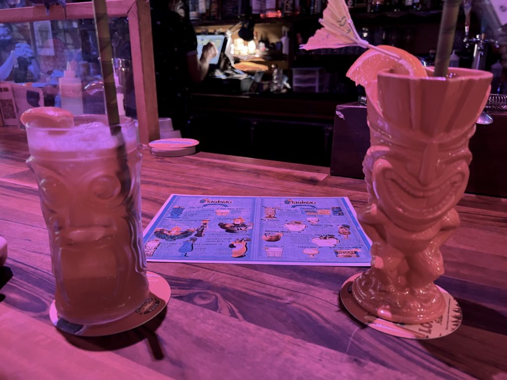 two glasses with drinks on a table