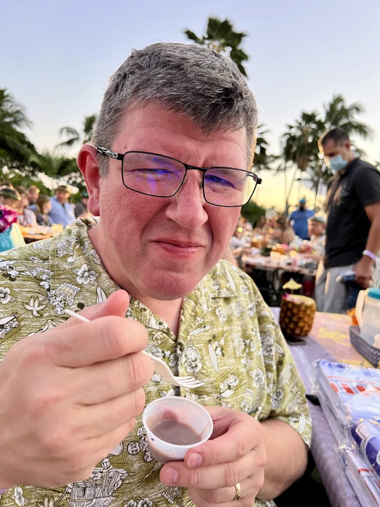 a man eating a dessert