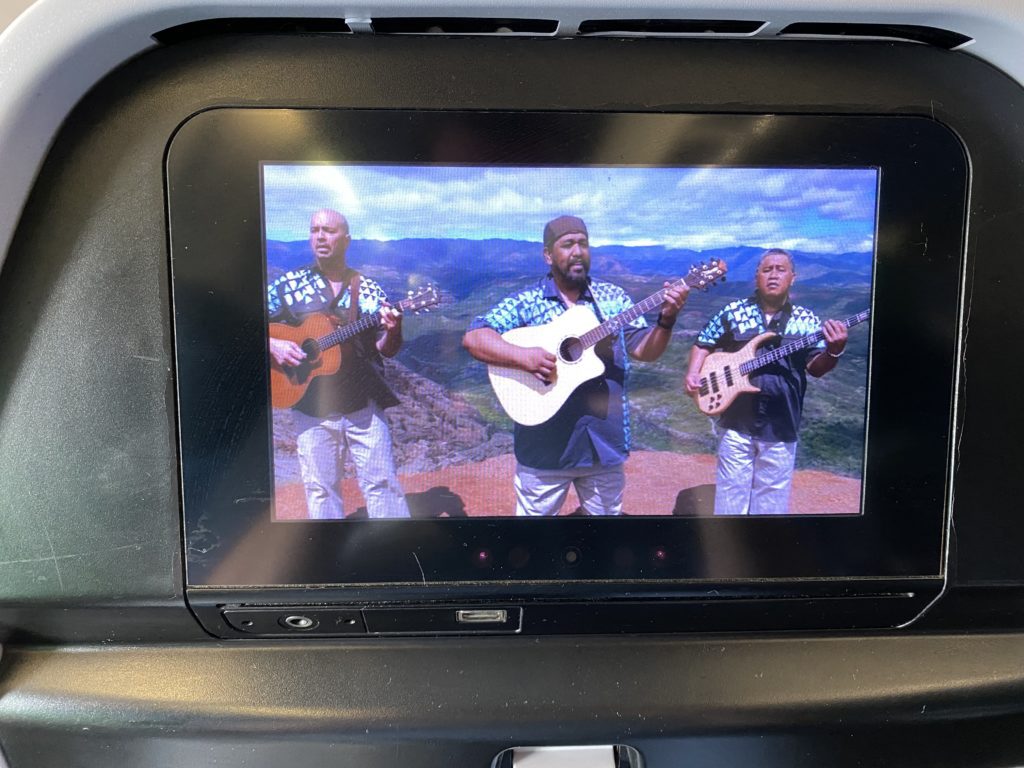 a group of men playing instruments in a car