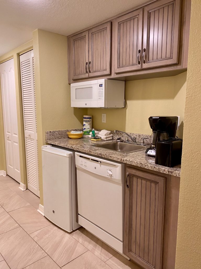 a kitchen with a sink and a microwave