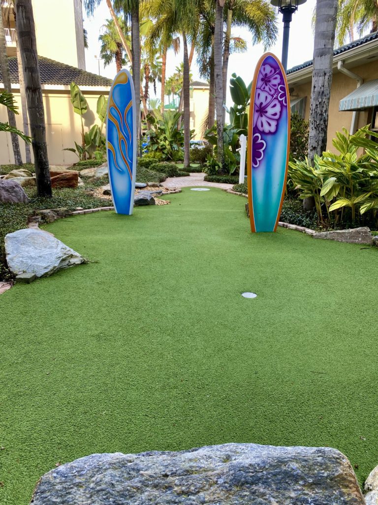 a miniature golf course with surfboards
