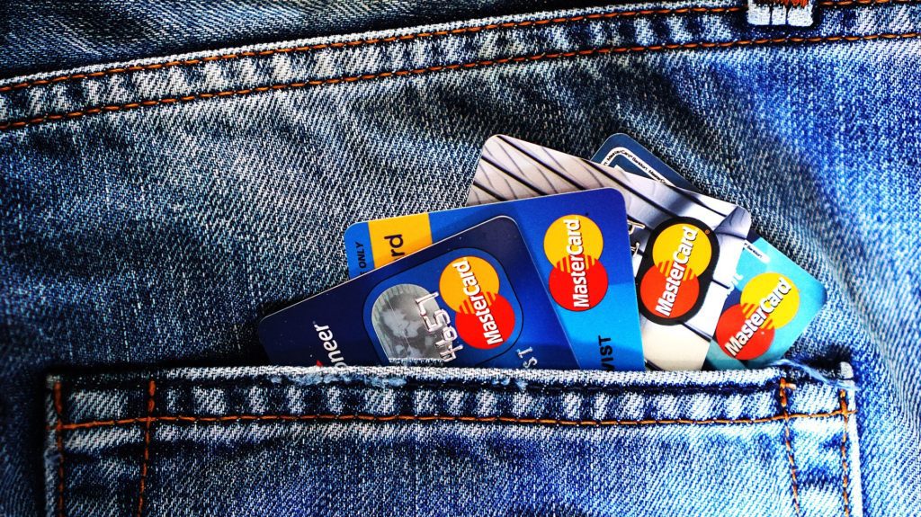 several credit cards in a pocket of jeans