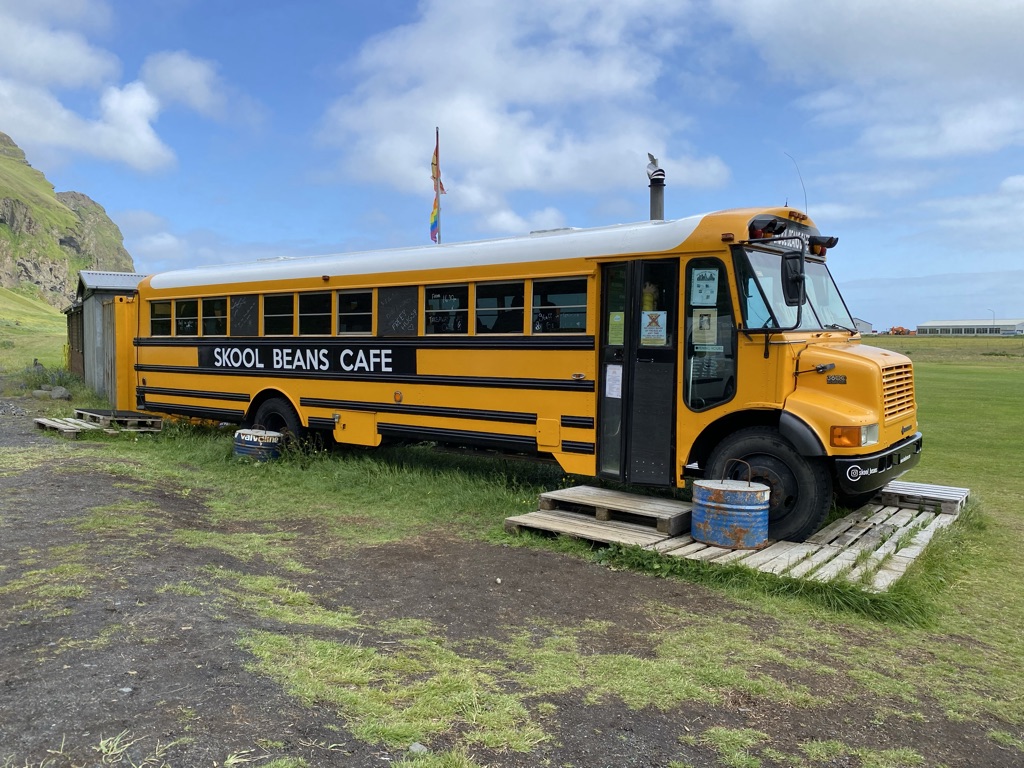 a school bus parked on a wooden platform