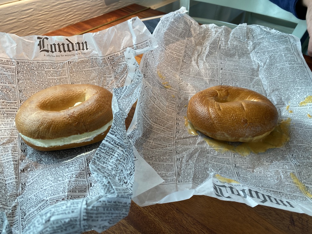 two bagels on a newspaper