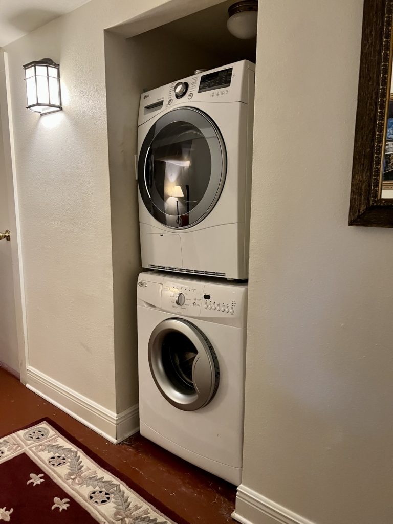 a washer and dryer stacked in a room