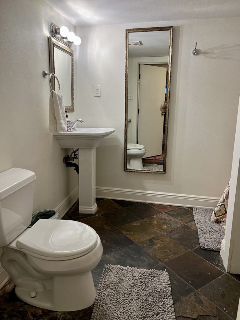 a bathroom with a sink and mirror