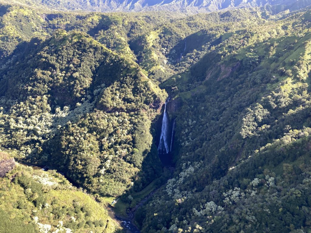 a waterfall in a valley