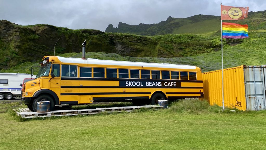 a yellow school bus parked on a track