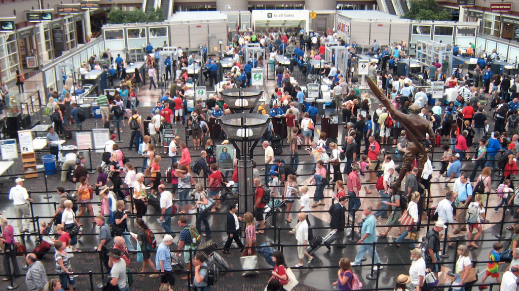 a crowd of people at an airport