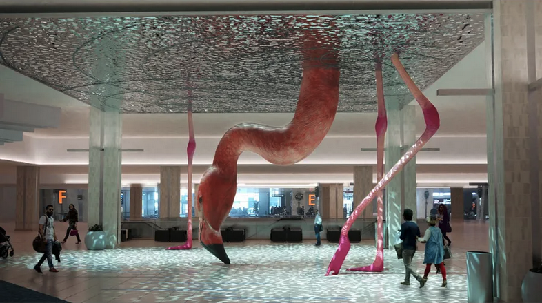 a large flamingo statue in a building