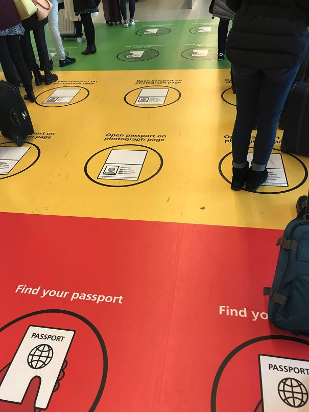 a group of people standing on a floor with luggage