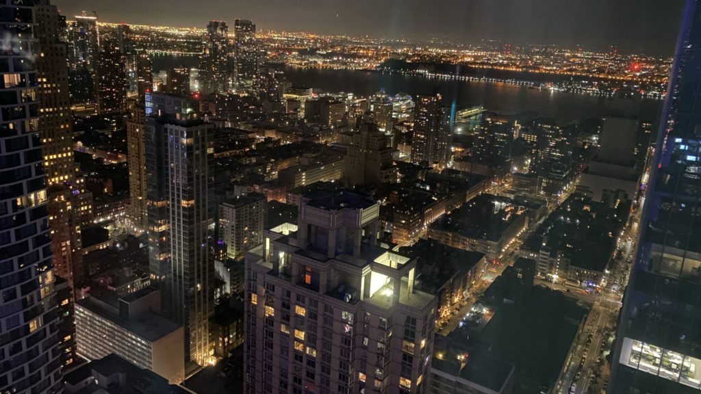 a city at night with water and city lights