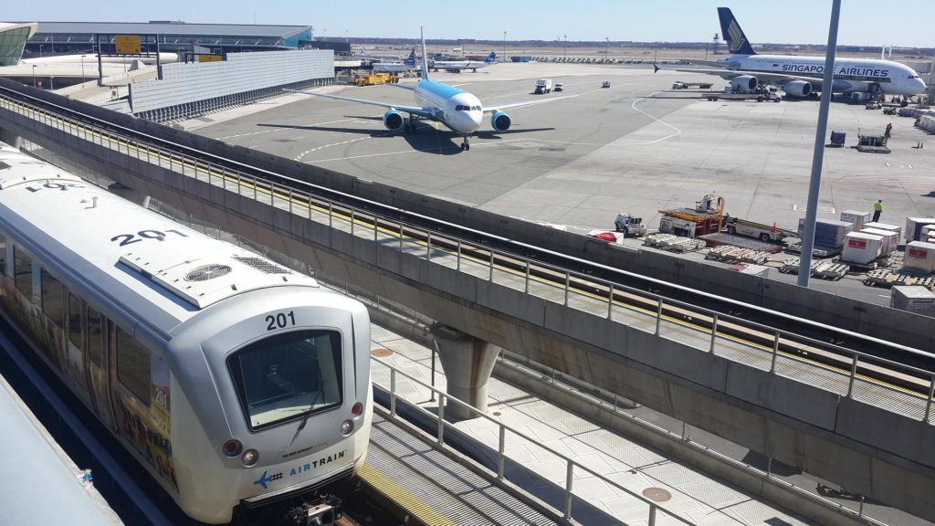 a train and airplanes at an airport